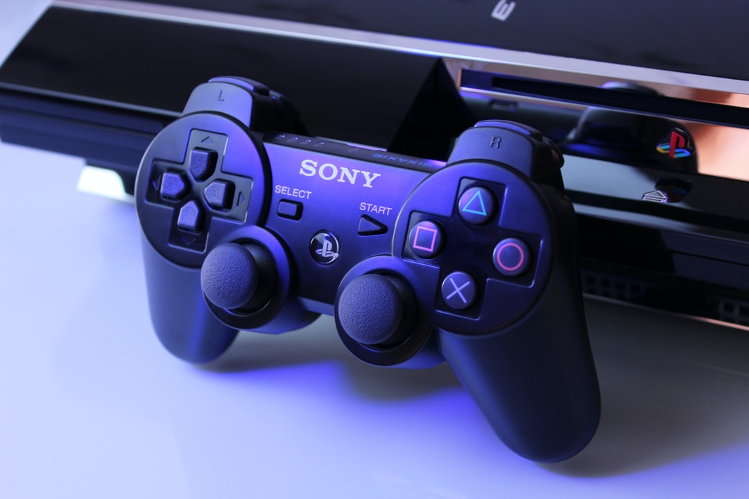 black Sony PS2 controller on white surface - Playstation 3 Semi-Transparent SIXAXIS Controller, tags: nfts evo - unsplash