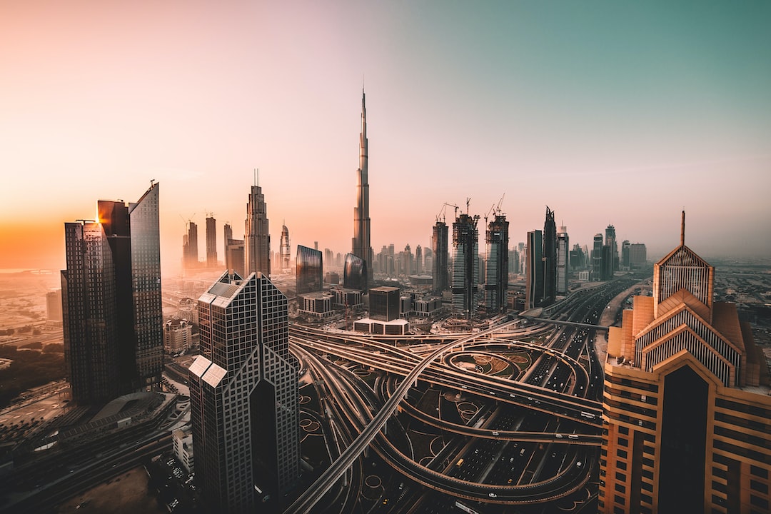 aerial photo of city highway surrounded by high-rise buildings - Sunrise shot of Downtown Dubai and Burj Khalifa., tags: ministry economy metaverse - unsplash